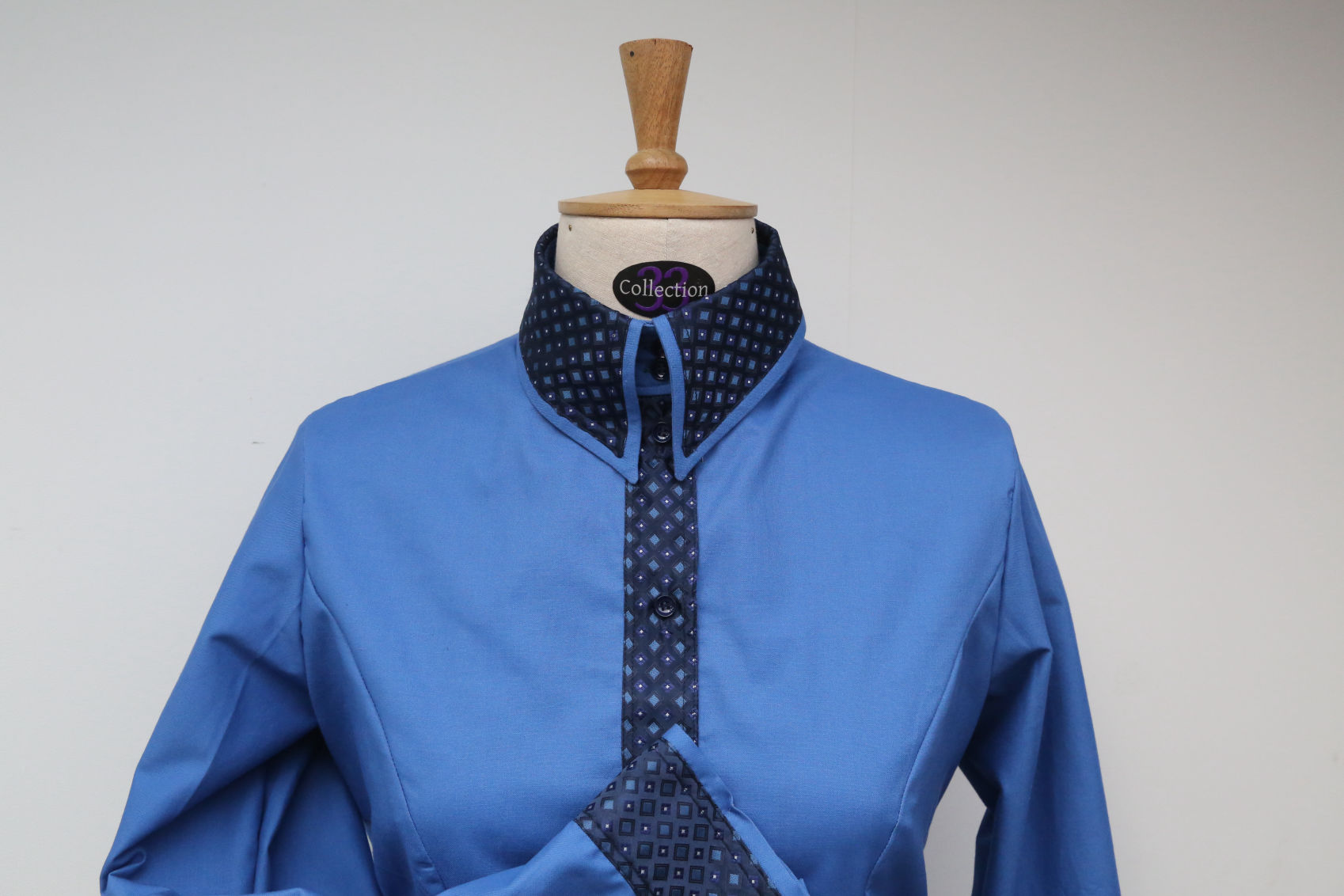 Close up of a custom Collection 33 Blue Cotton Classic Shirt with contrasting French Navy Detailing