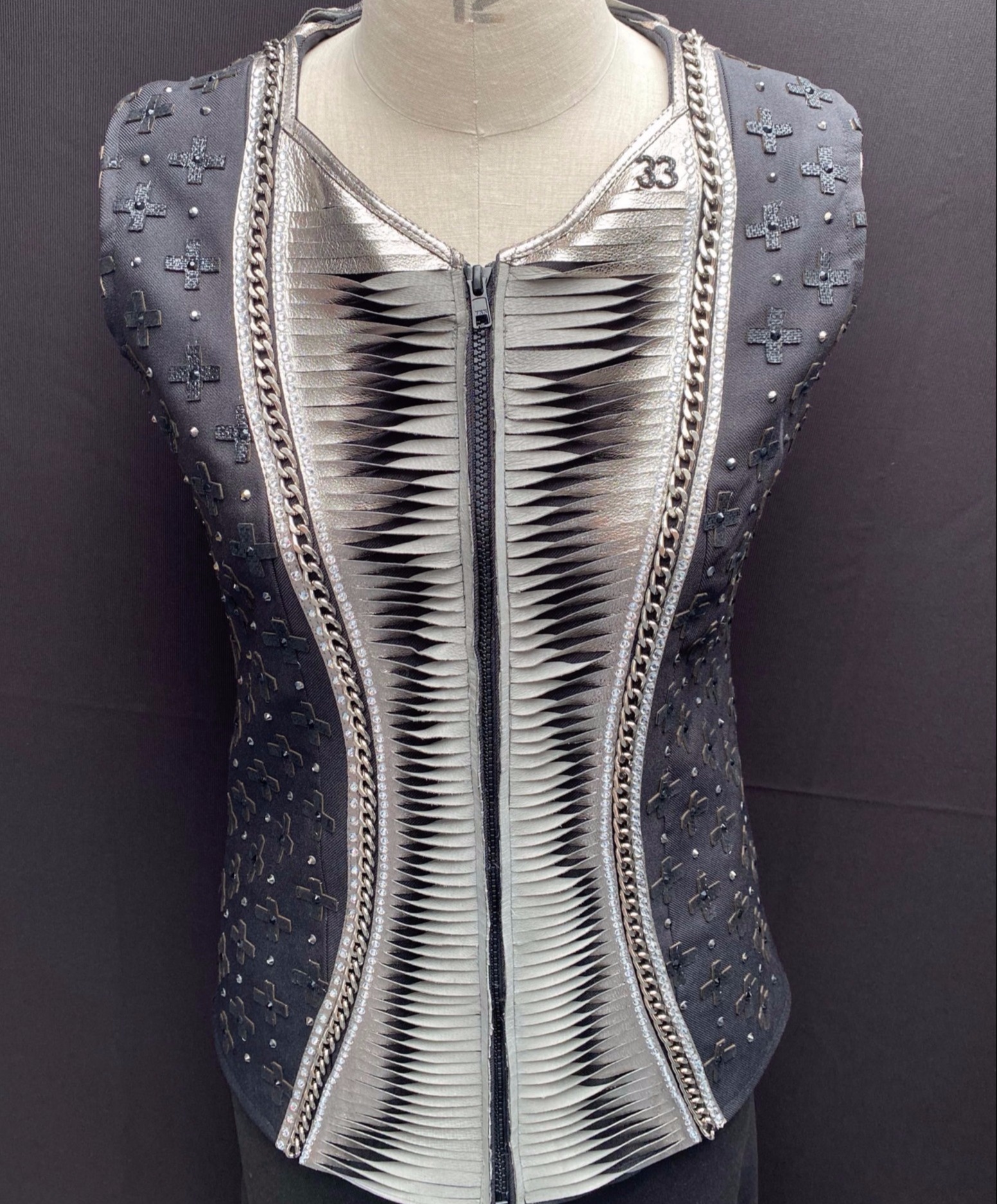 For Sale: Collection 33 dare devil riding vest detailed with silver, grey and black leathers, gunmetal chain and crystals 